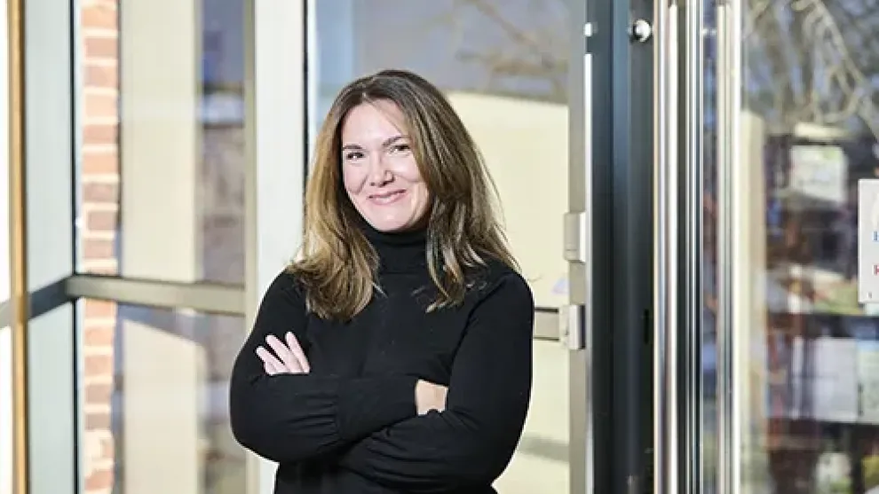 Lady with arms folded looking at the camera