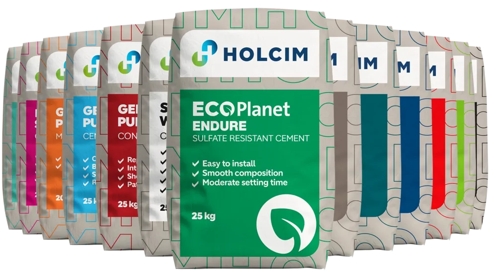 Paper bags of Holcim ECOPlanet Endure cement stacked neatly together in formation.
