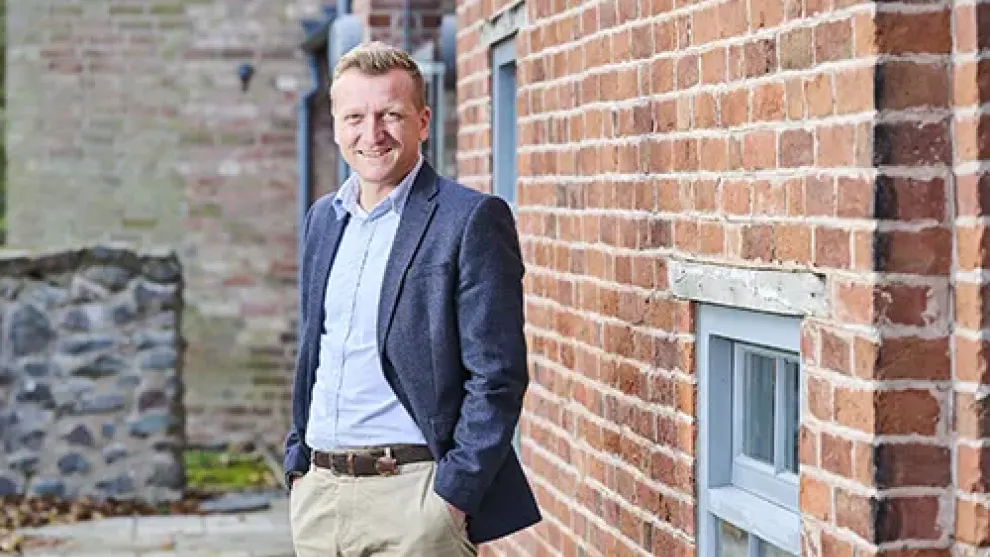 Man with hands in pocket looking at the camera