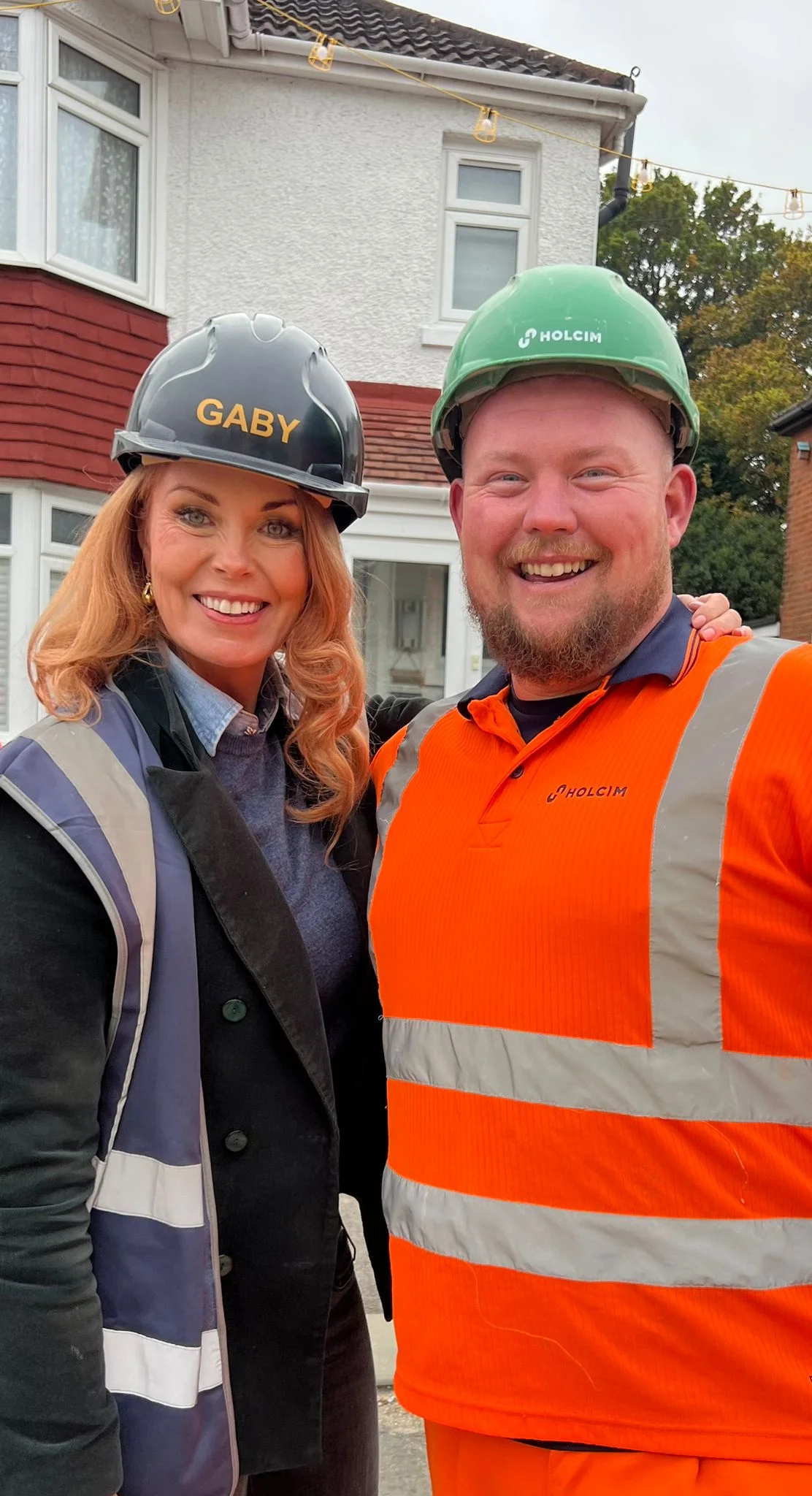 Holcim's Chris Davidson on the set of DIY SOS with designer Gaby Blackman
