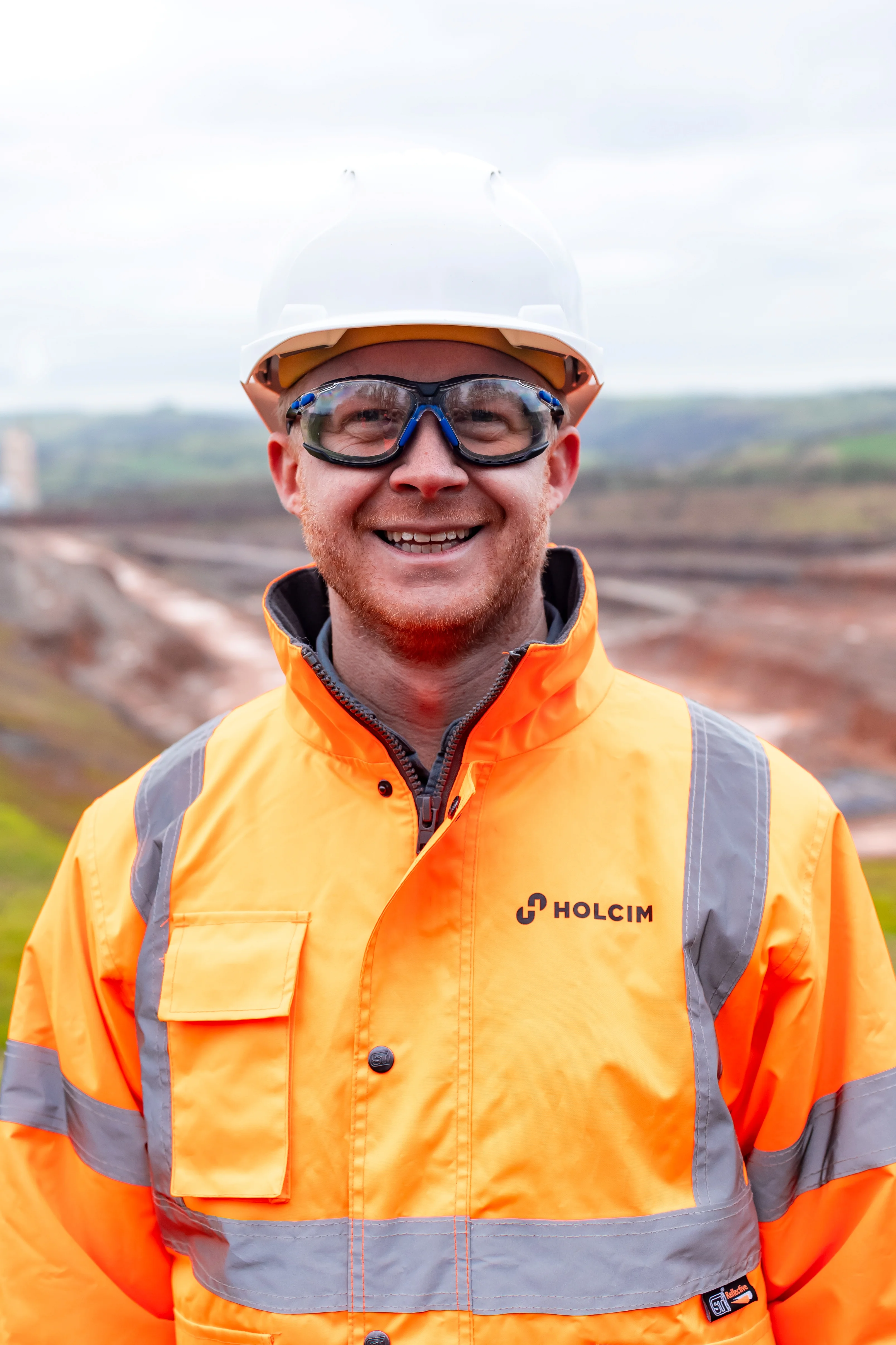 Holcim UK Head of Sustainability Tom Redfern in high viz PPE at Cauldonb Quarry in Staffordshire