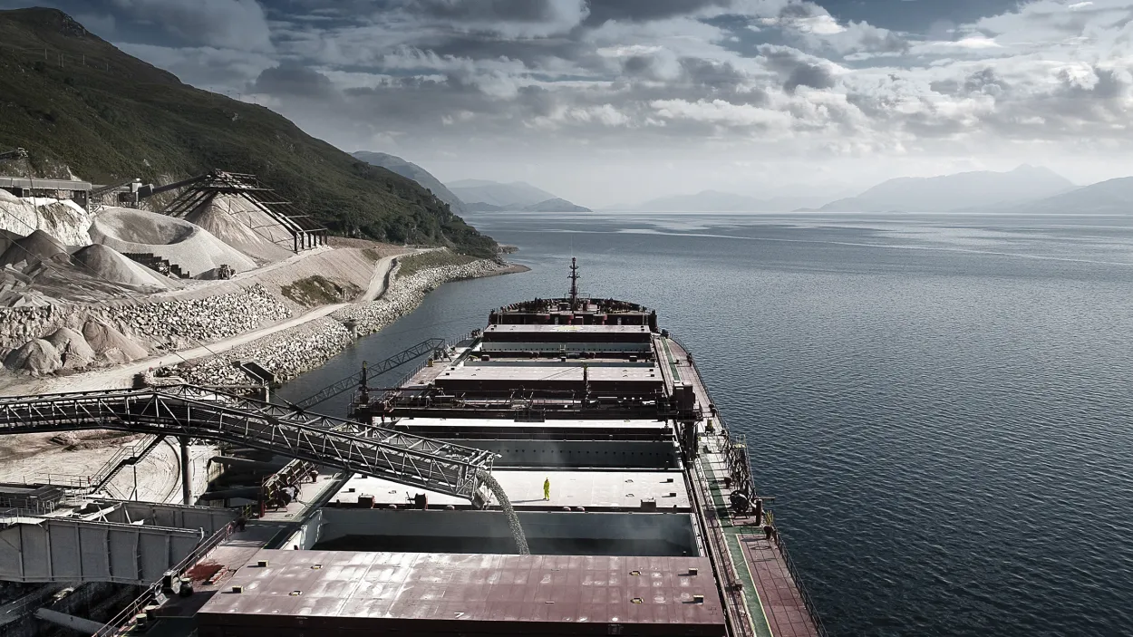 Boat receiving aggregate on the cost of Glensanda quarry