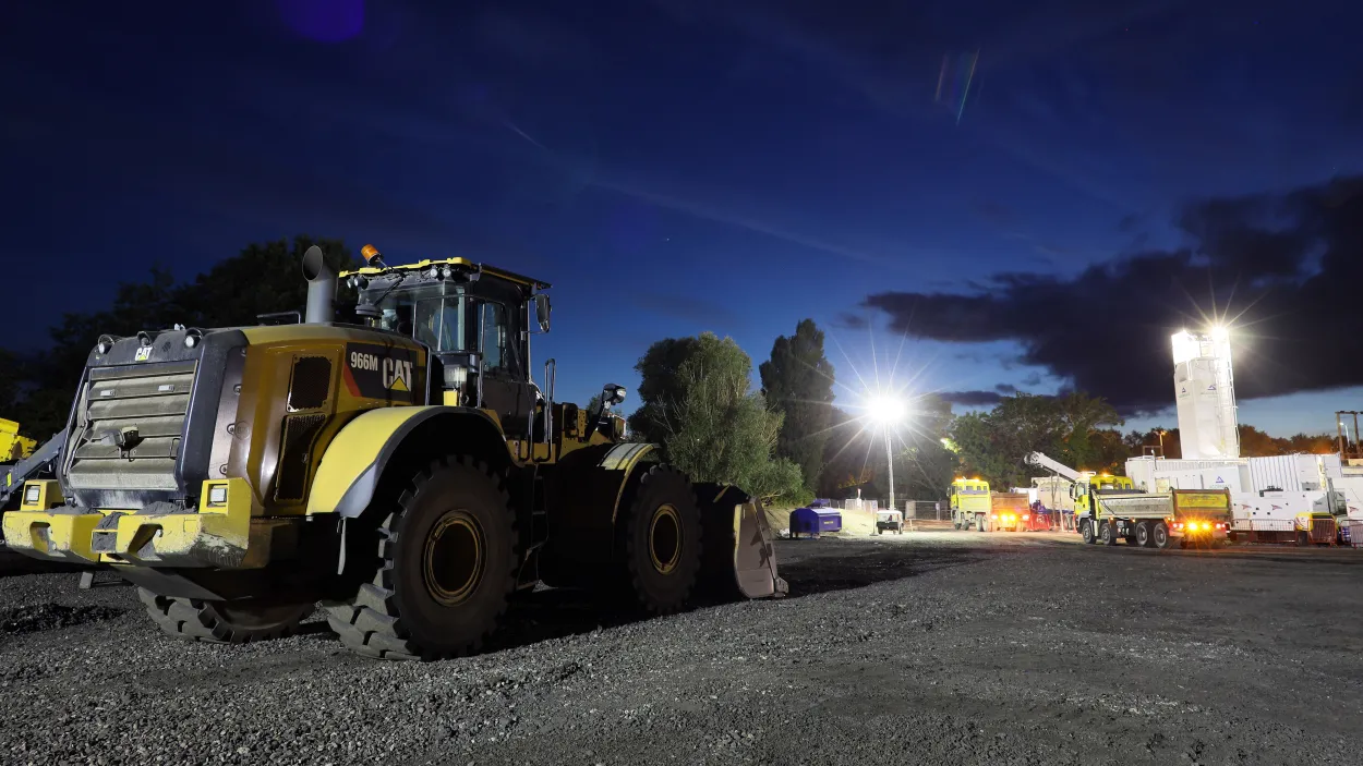 CAT digger in A46 plant at night