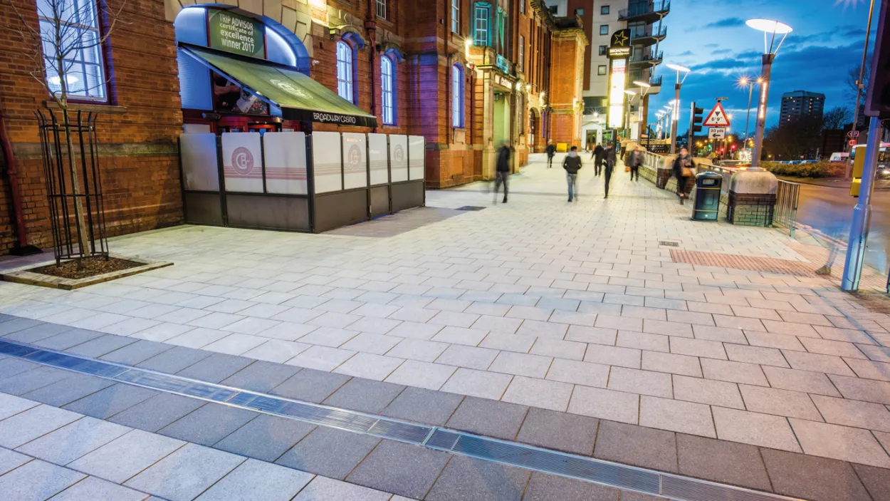 Charcon Appalachian concrete flag paving displayed on a project in woodgate in stevenage at night
