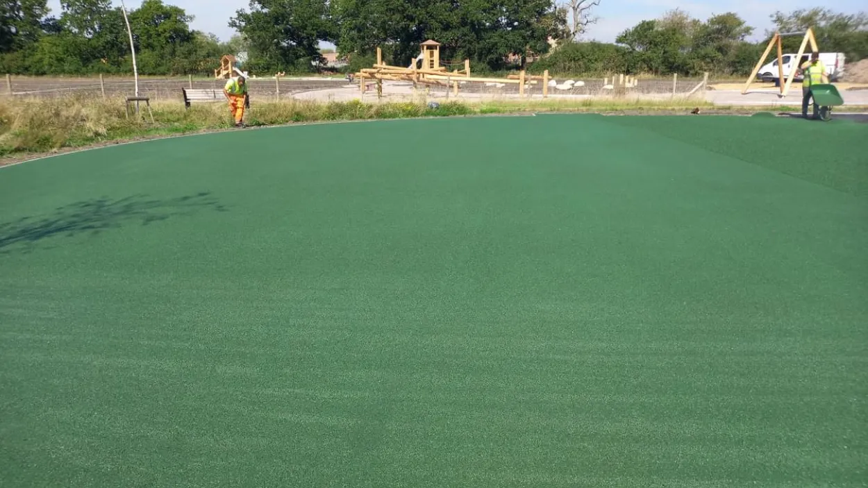 SuperColour Ultra porous green being laid at a school playground.jpg