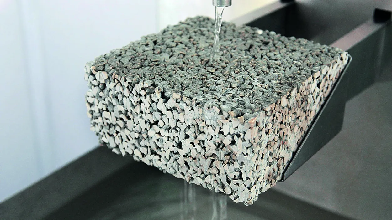 Close-up of Hydromedia water-permeable concrete showing its porous, textured surface designed for drainage.