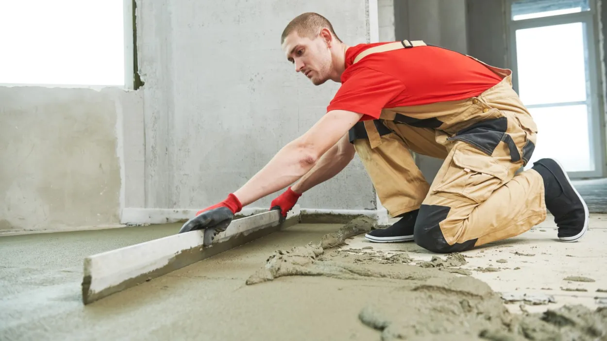 Screed being levelled out on a floor