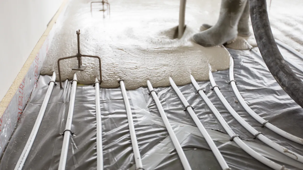 Cemfloor screed being poured over underfloor heating