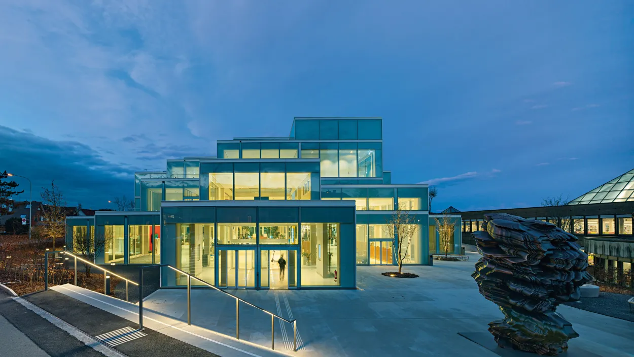 The Square StGallen building outside at night