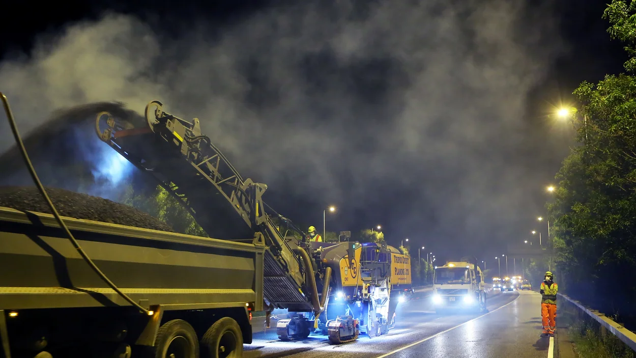 A planer removes the top surface of the road during works to resurface the M42 Motorway by Holcim