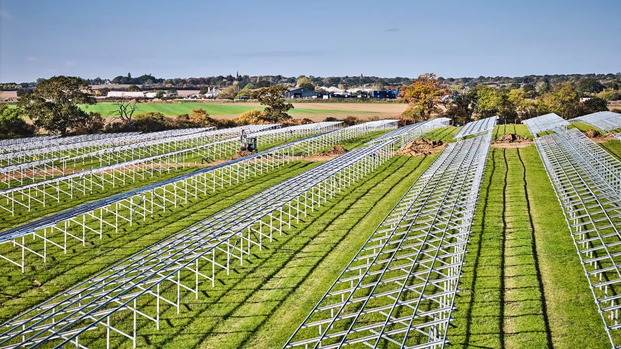 Field filled with solar panel frames