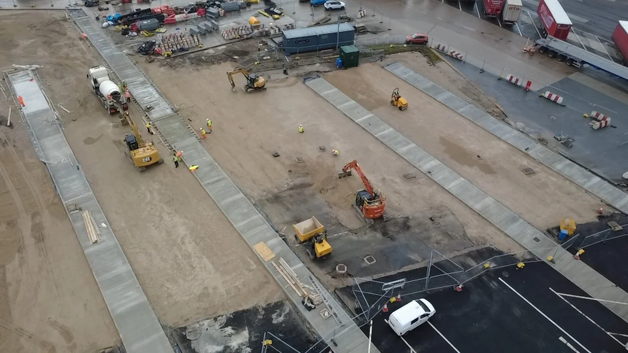 An aerial view of a concrete mixer truck delivering readmymix concrtete to Heysham Port from the Holcim Lancaster RMX plant