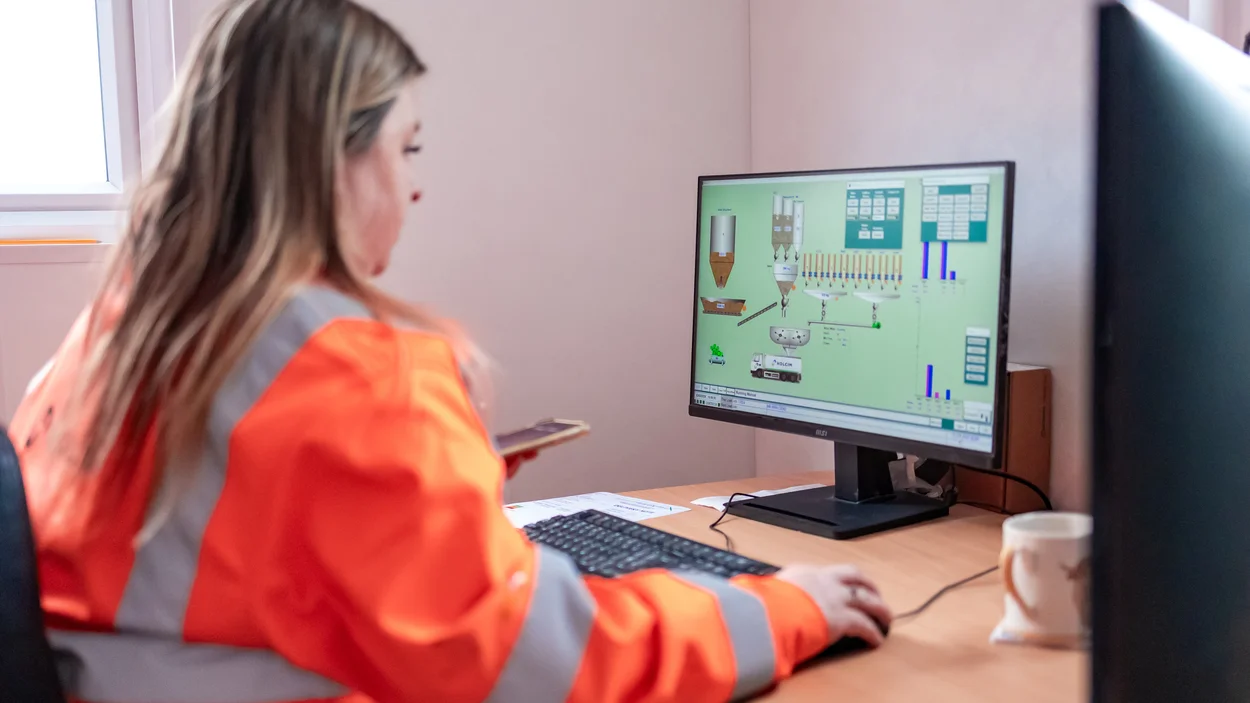 Emily Freeman views a computer screen at her desk at Holme Park Mortars Plant