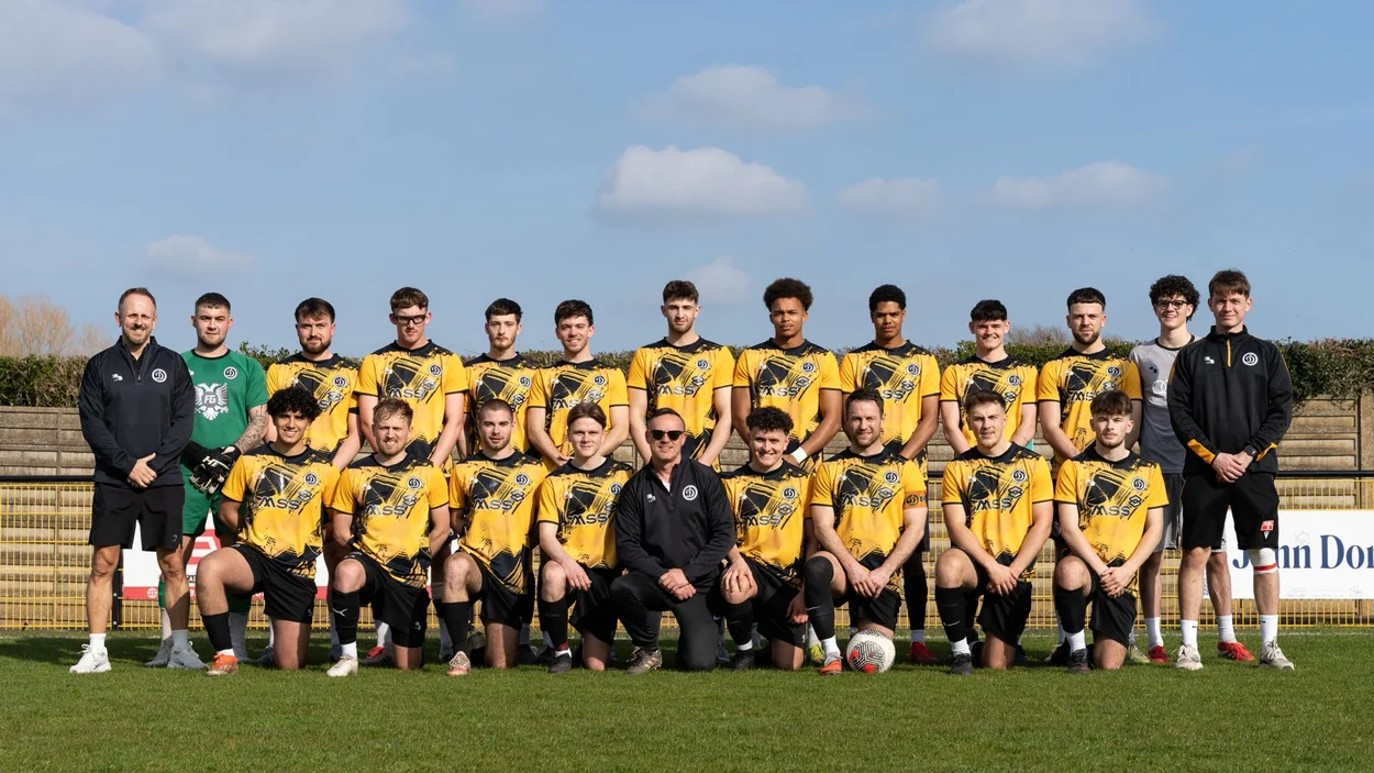 Danny King (far left) and the football team he coaches
