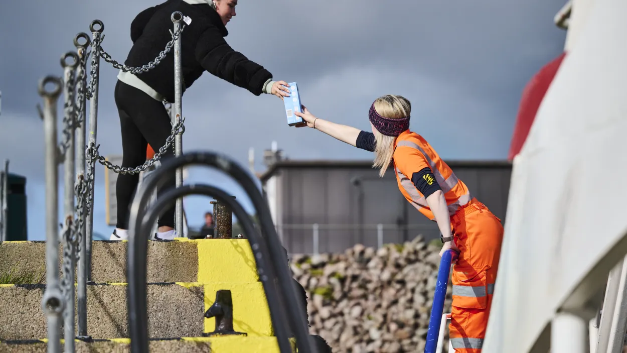 Coxswain Lawrie Cerexhe delivering vital supplies from the mainland to Glensanda Quarry