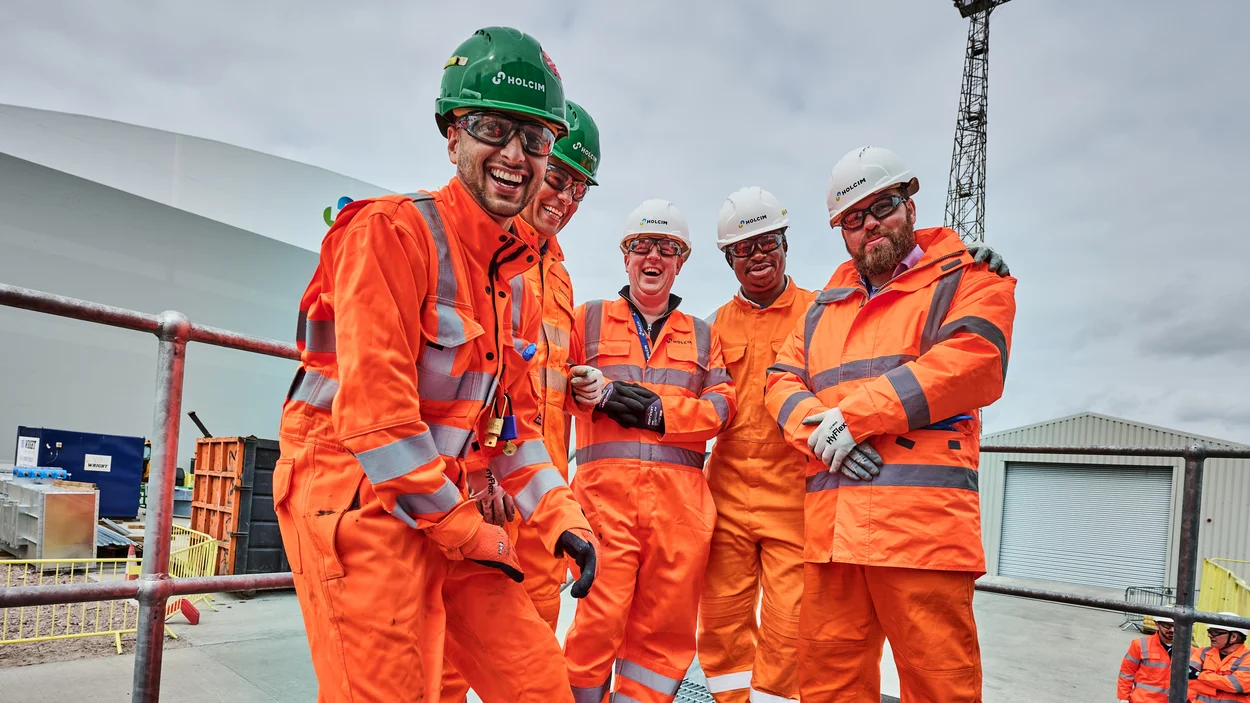 Members of Holcim UK's Tilbury site posing for a team phoot weatring full PPE.