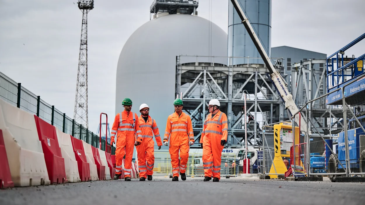 Members of the Holcim UK Tilbury team walking on site in PPE