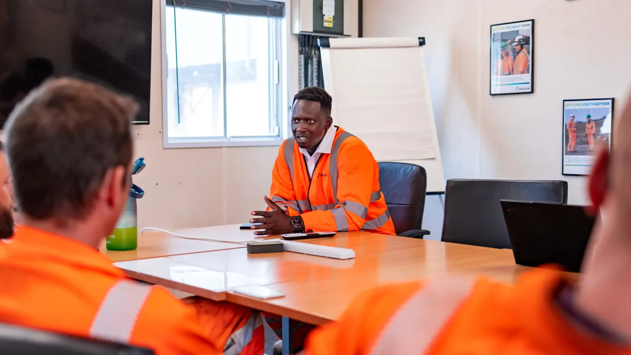 Mustapha Nyass, regional operation manager, at the Sheffield Asphalt Plant in a meeting with colleagues.