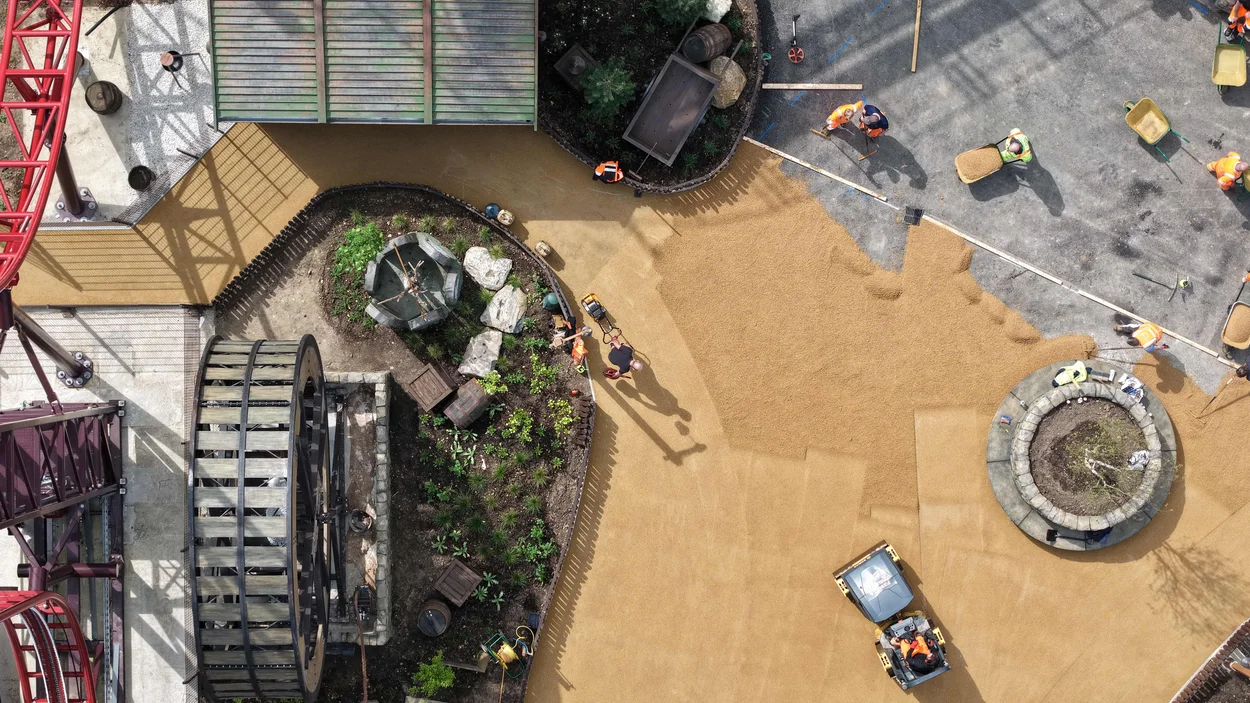 An aerial view of contractors laying Holcim's Supercolour Ultra Buff at Paulton Park new Valgard- Realm of the Vikings area