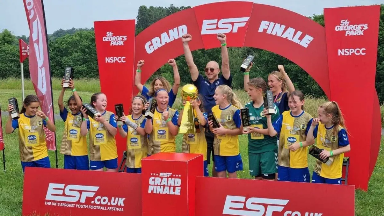 Adam Kutcher with the St Alban's Lionesses team he coached.