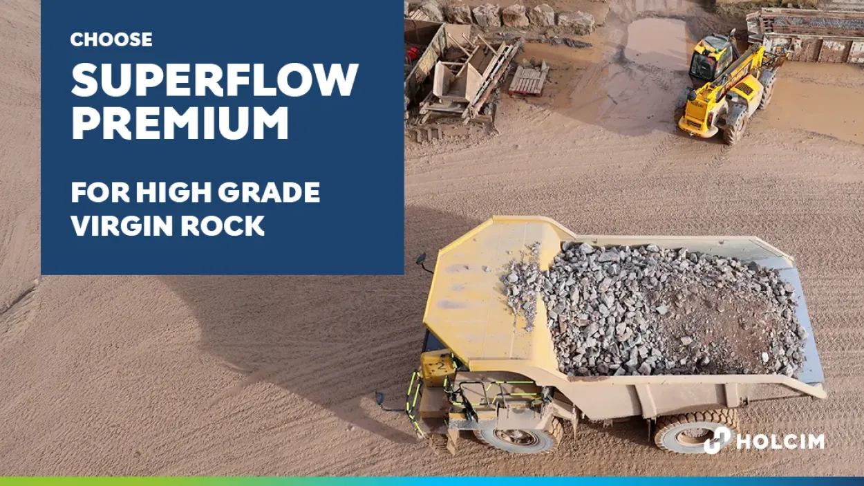 Tipper truck carrying freshly quarried virgin rock
