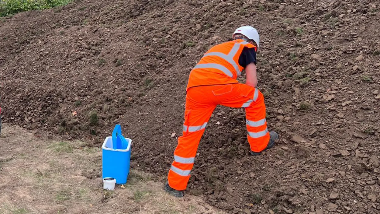 PPE worker inspecting samples