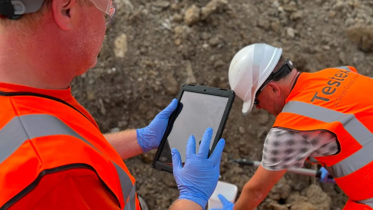 Workers inspecting samples with an ipad