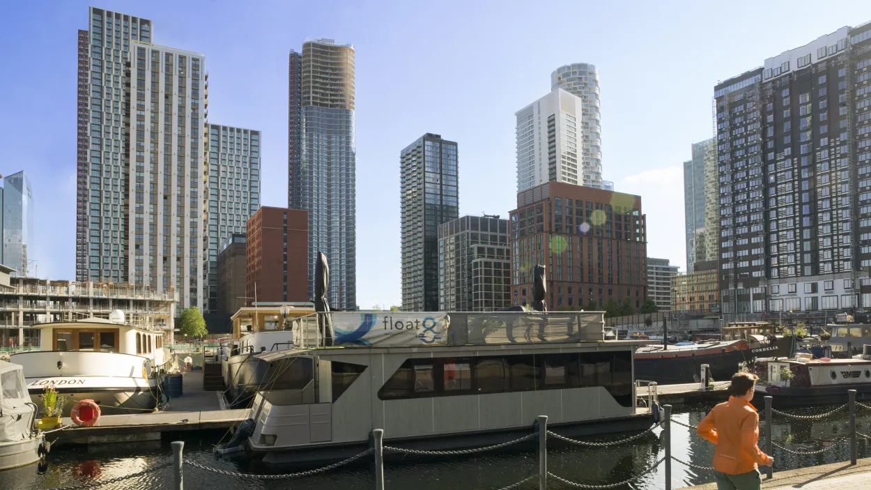 person running along a dock front at wood wharf