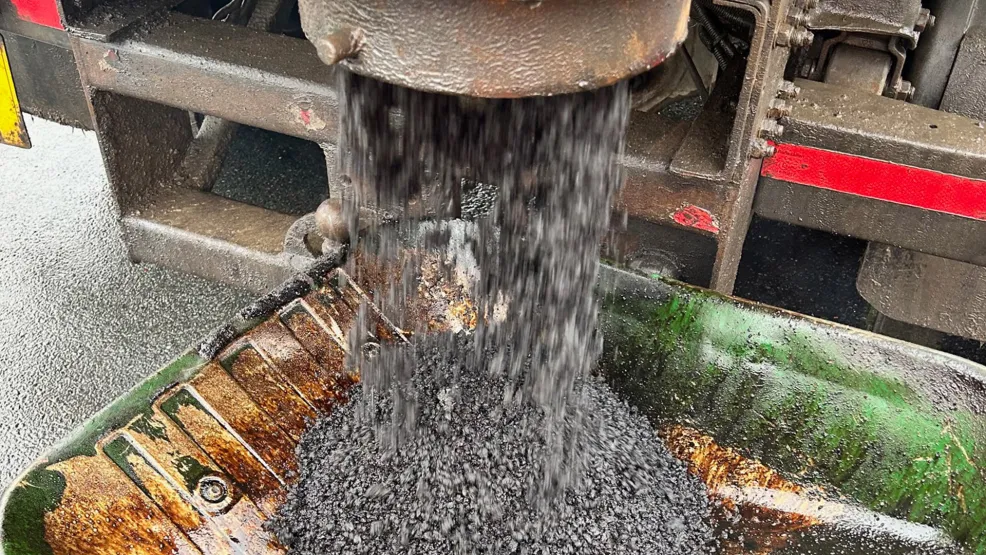 Supertrench being poured into a wheelbarrow