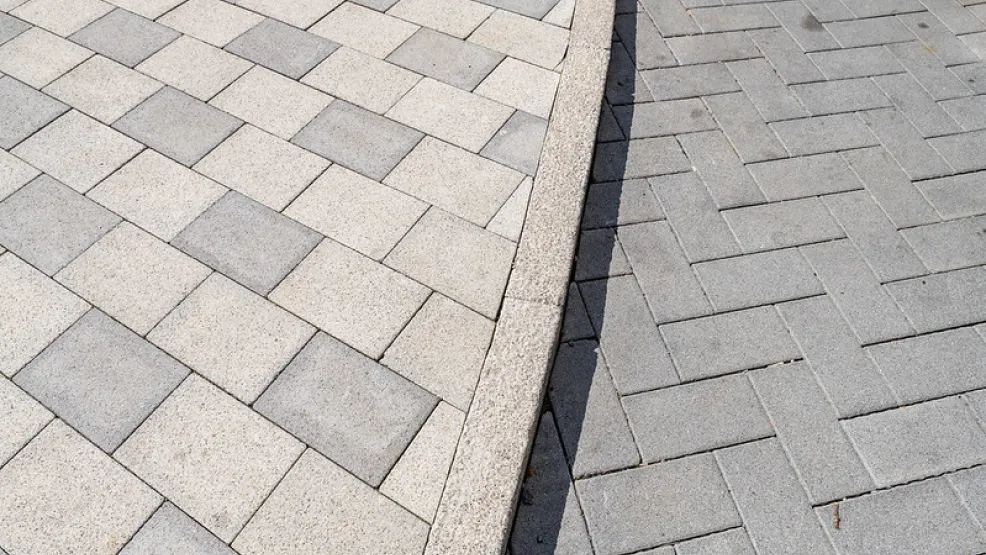 Close up image of block paving and kerb