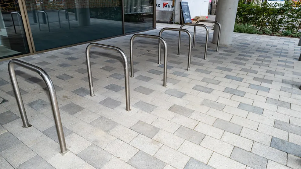 Bike racks on grey block paving