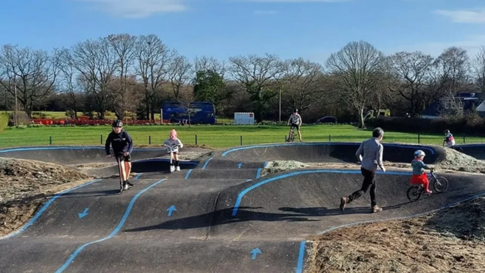 Children playing at Sullivan pump track after completion