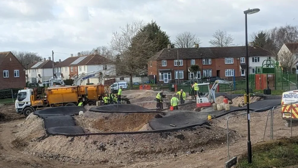Workers paving the new pump track