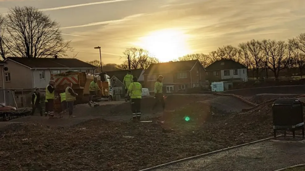 Workers completing works on the new pump track at night