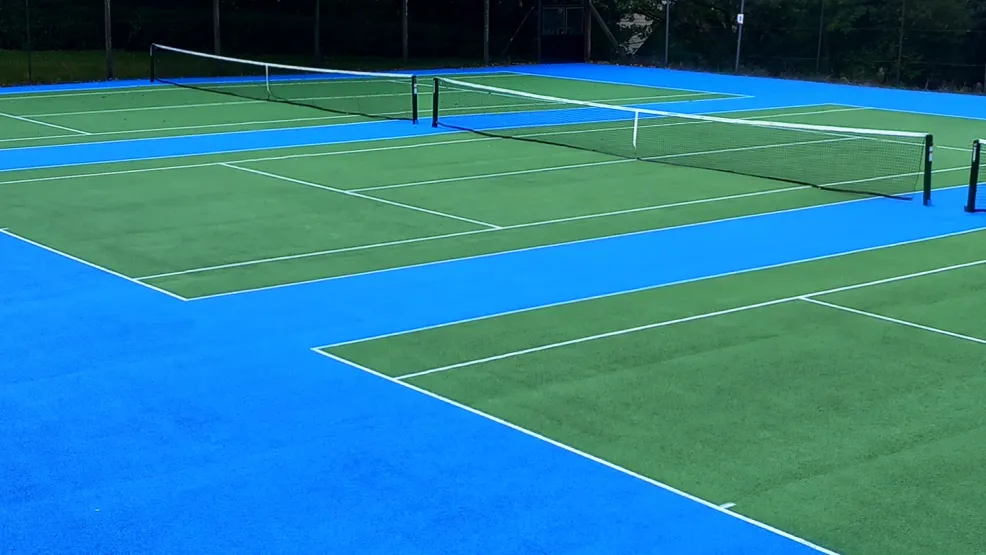 Looking over freshly resurfaced tennis courts at Oakhill Park