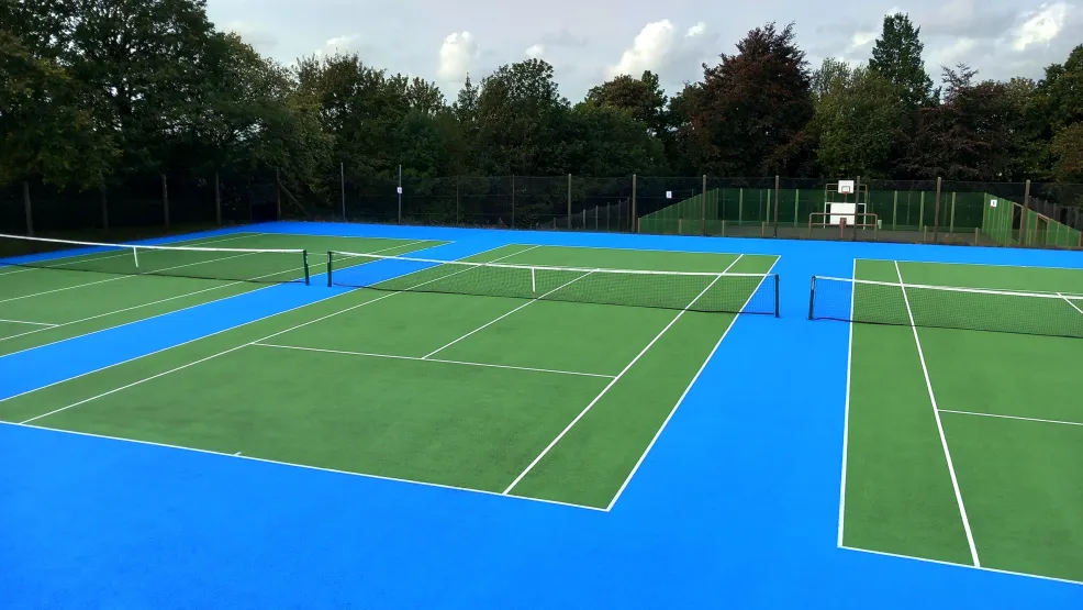 Looking over three completed new tennis courts at Oakhill Park