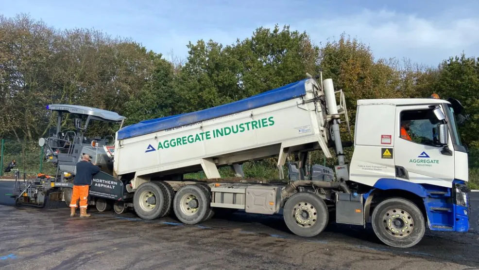 Tipper truck dropping asphalt into a Norther Asphalt paver