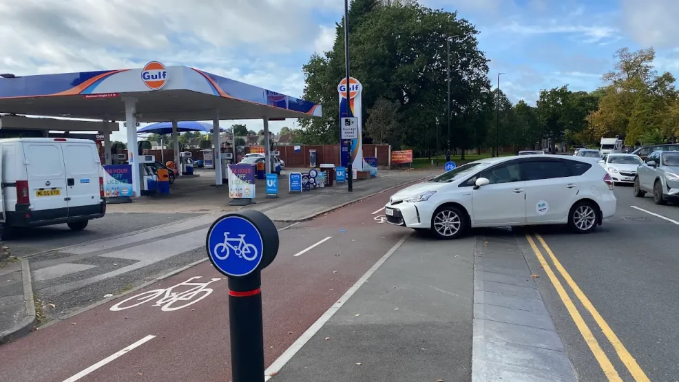 The Charcon dutch cycle kerb laid at a busy crossing across a cycle path the enter a petrol station along coundon road in coventry
