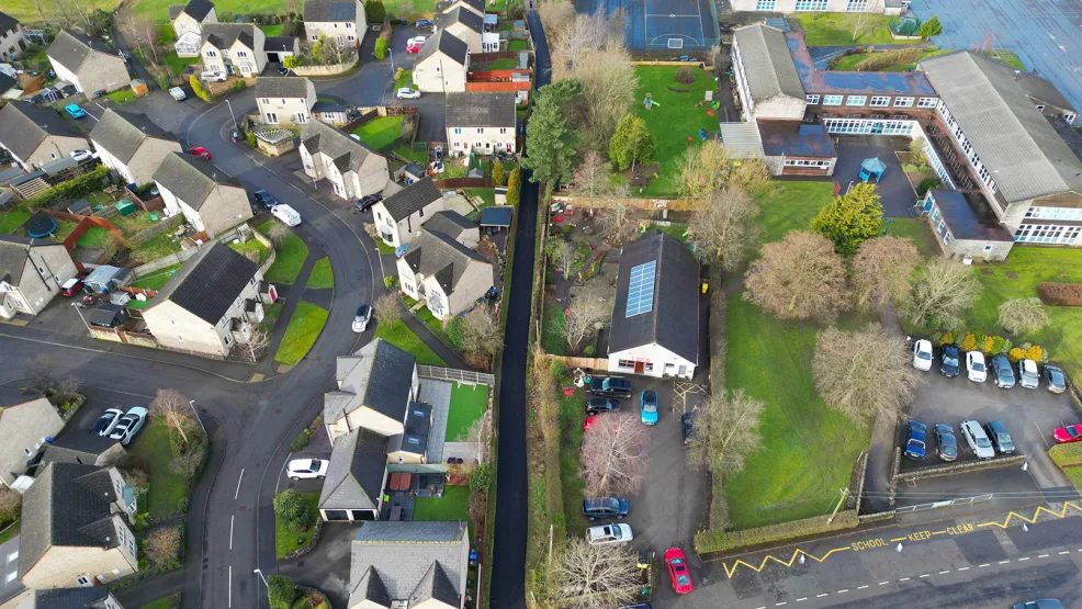 Drone picture taken above Waterhouses new lane with a housing estate and school seen on either side
