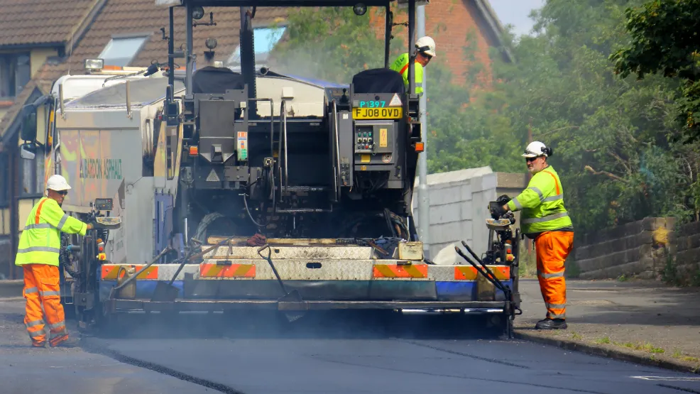 Road asphalt resurfacing in a residential area