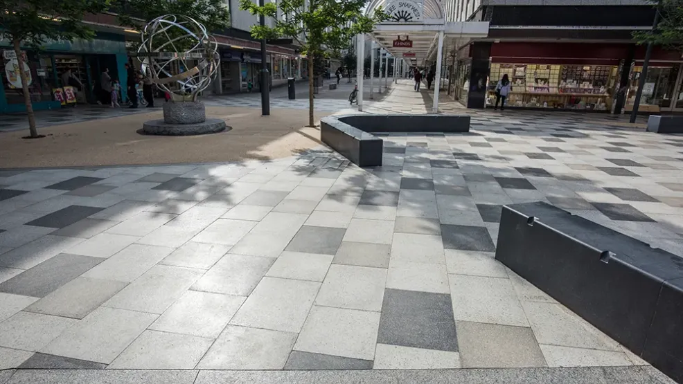 City centre shopping area with modern seating and flag paving