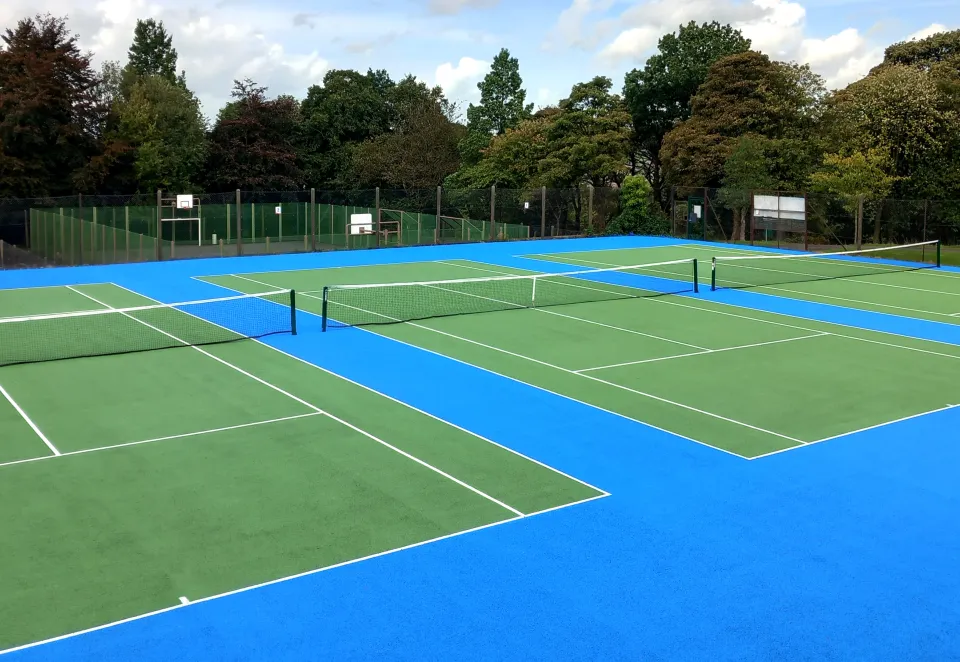 Looking over three newly laid tennis courts at Oakhill