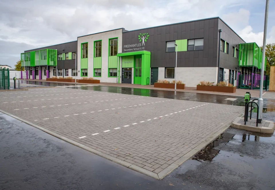 An image showing our stonemaster infilta to demonstrate how the Suds range works - here you can see it has been raining the Asphalt is wet but the paving is dry due to the way it is designed to absorb rain and encourage run-off