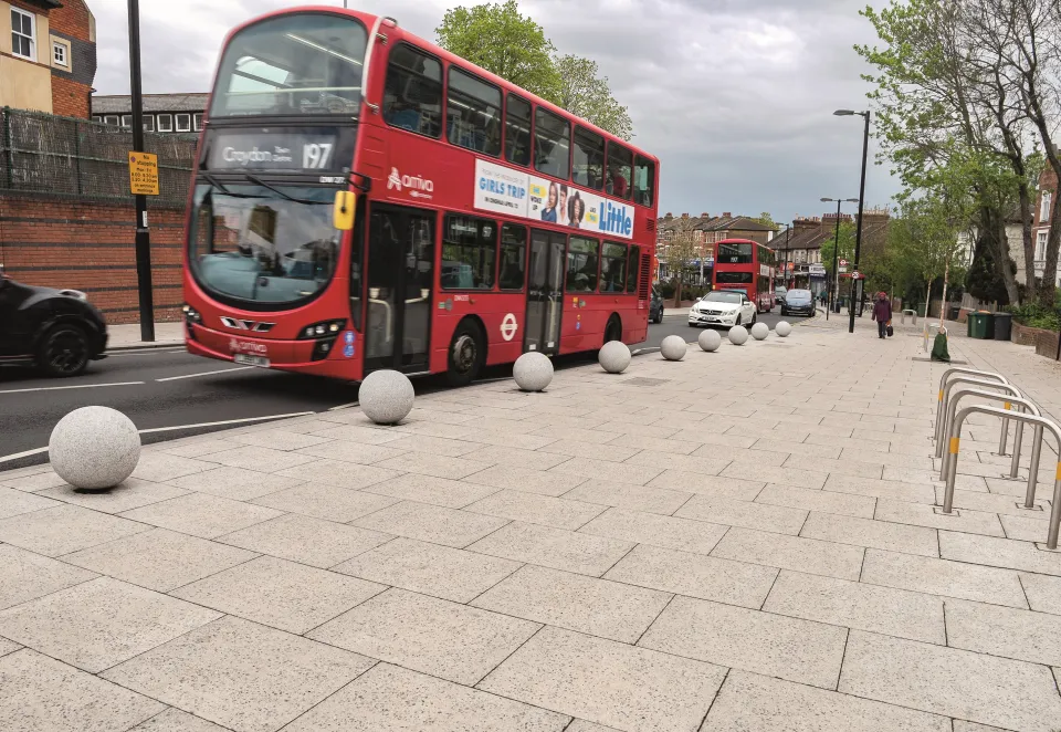 A header image for Charcon's Ultrapave paving laid in london featuringa london bus 