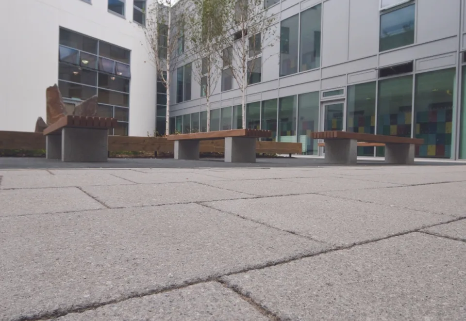 An image of moordale texured paving in grey outside Loxford school in london