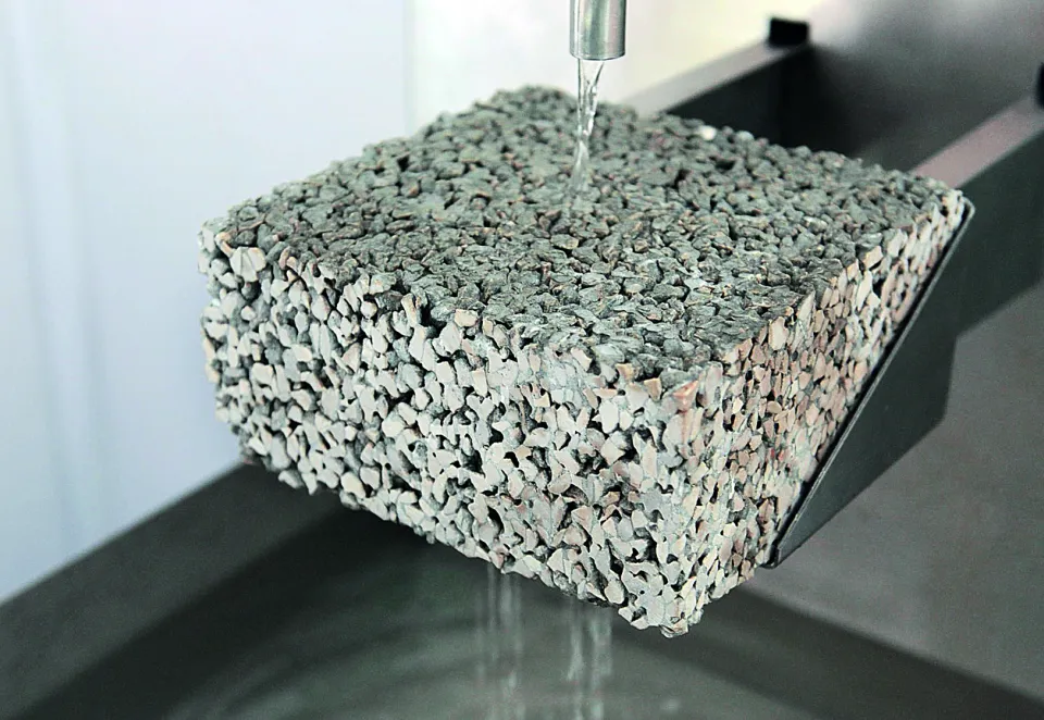 Close-up of Hydromedia water-permeable concrete showing its porous, textured surface designed for drainage.