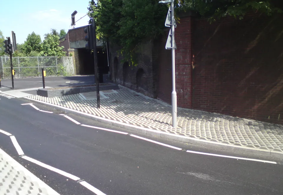 A picture of Elite Deterrent laid near a pedestrian walkway