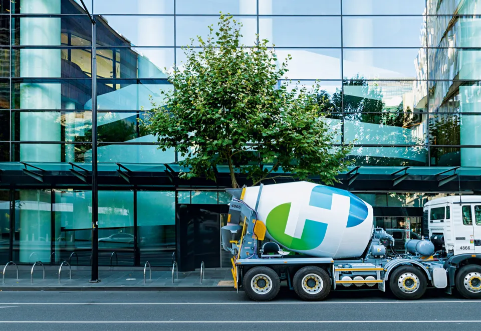 Cement mixer in front of a building
