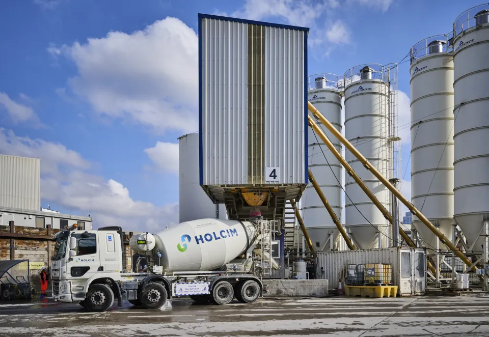 A Holcim UK mixer truck being filled with biochar coffee concrete at its Battersea Readymix plant in London