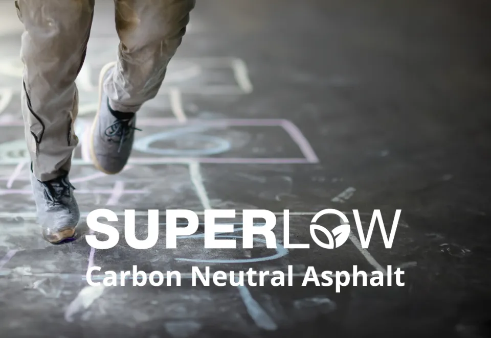 hopscotch with person playing and the text SUPERLOW Carbon Neutral Asphalt